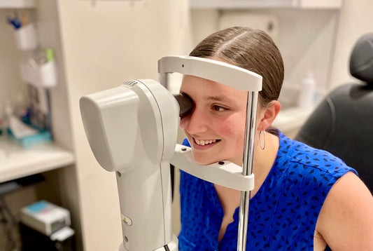 Young lady getting fitted with ortho-k lenses.