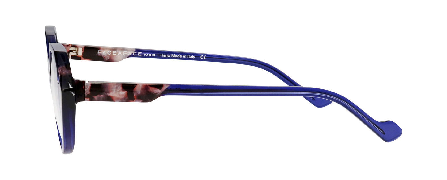Women's prescription eyewear – A side view of an acetate frame that is hexagonal in shape and ink blue in colour with tortoiseshell accents.