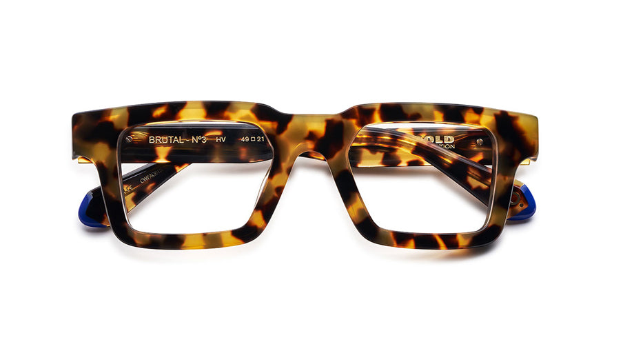 Unisex prescription eyewear: A front view of a bold tortoise square frame made of acetate. The Etnia insignia located on the inside of the temple tips.