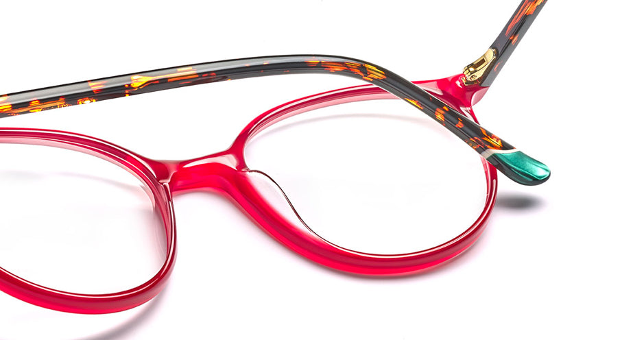 Women’s prescription eyewear - A close-up of the Tulip frame: An oval red front with tortoise temples, green tip and gold hinge.