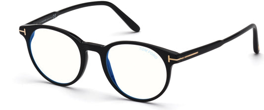 Men's prescription eyewear – A side view a black frame in a round shape. It is made of plastic and has a gold line, in the shape of a T, running across from the hinge to the temples.