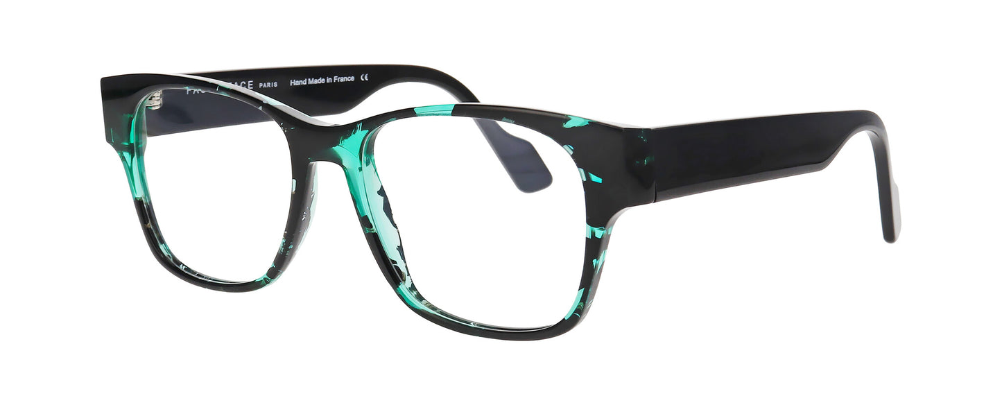 Men's prescription eyewear – A partial side view of a square acetate frame that is black and clear green tortoise in colour