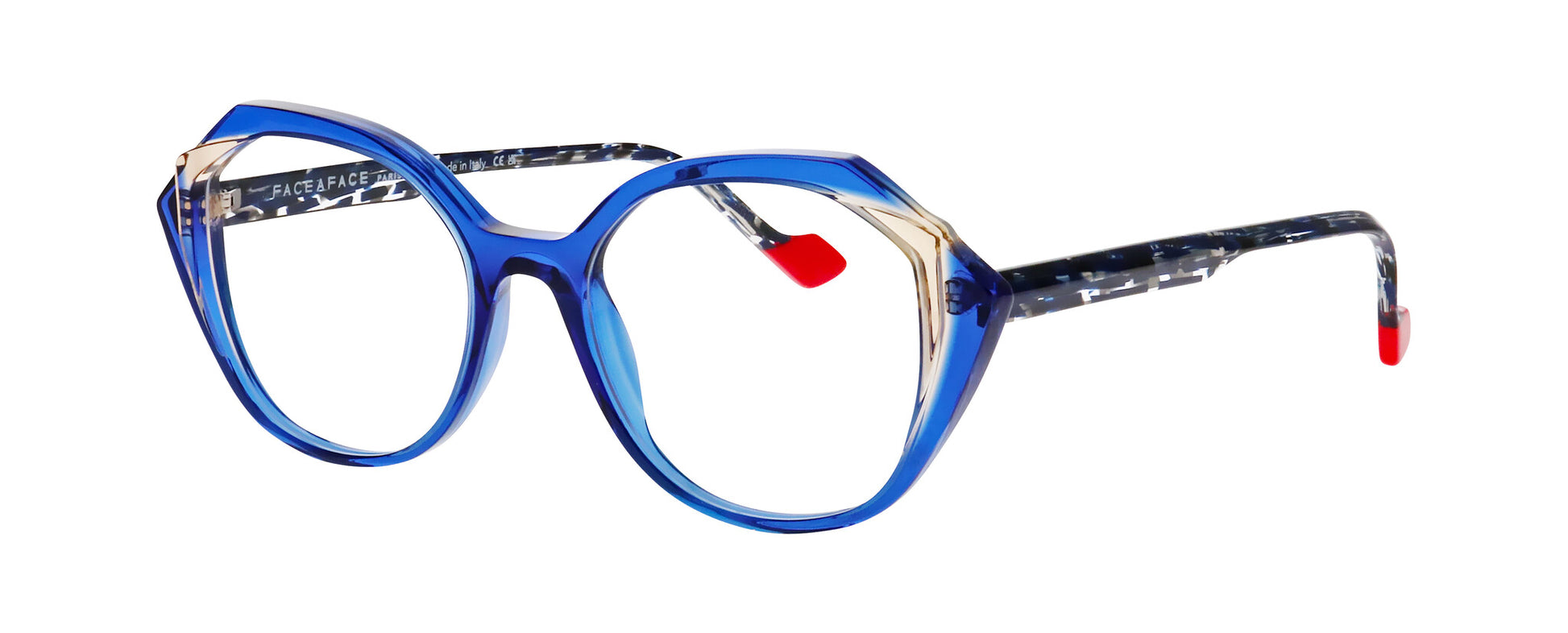 Women's prescription eyewear – A partial side view of an acetate frame that is geometric in shape and ultra blue/transparent in colour.  The blue and white speckled temples are finished with red tips. 