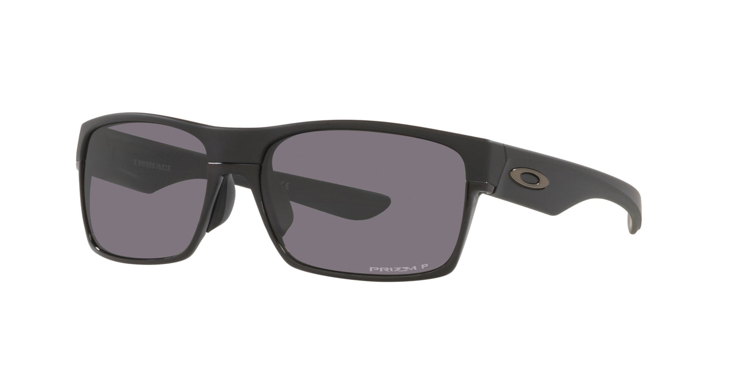 Men’s sunglasses - A side view of the Two Face model:  A rectangular matt black frame made of Oakley's trademark O Matter lightweight material. The lenses are prism grey and polarized