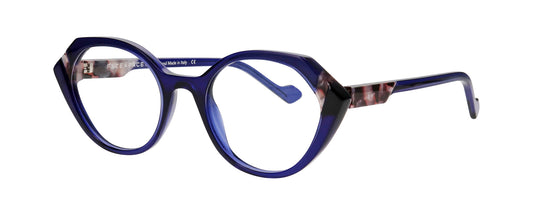 Women's prescription eyewear – A partial side view of an acetate frame that is hexagonal in shape and ink blue in colour with tortoiseshell accents.  