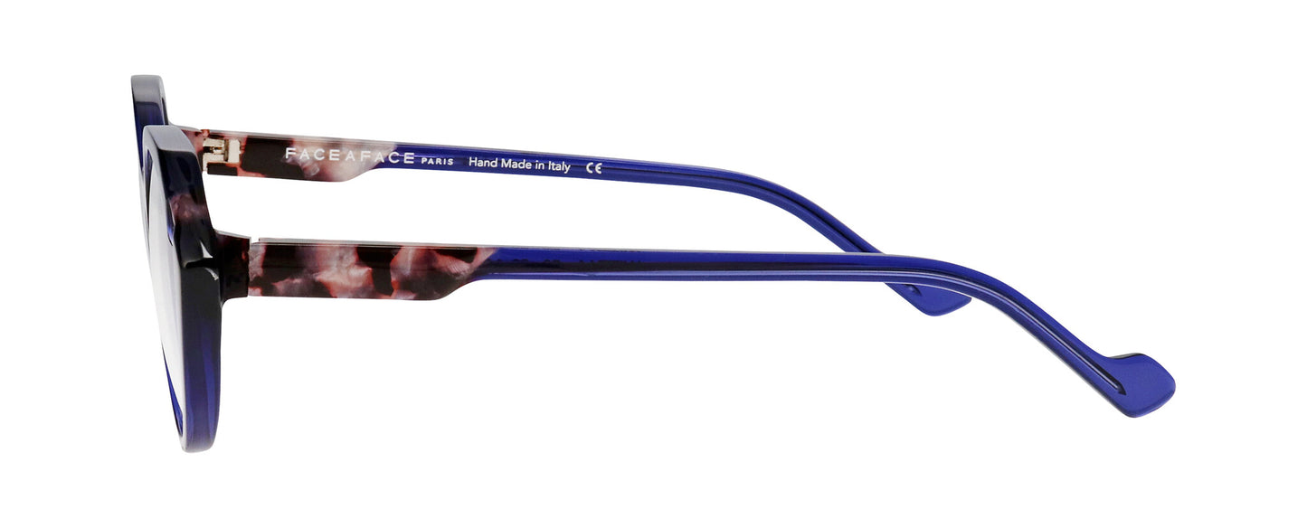 Women's prescription eyewear – A side view of an acetate frame that is hexagonal in shape and ink blue in colour with tortoiseshell accents.  