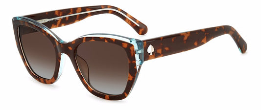 Women's sunglasses: A cat eye acetate frame in Havana brown with clear plastic trim on top. The lenses are brown gradient and the metallic Spade insignia is located on the temples.
