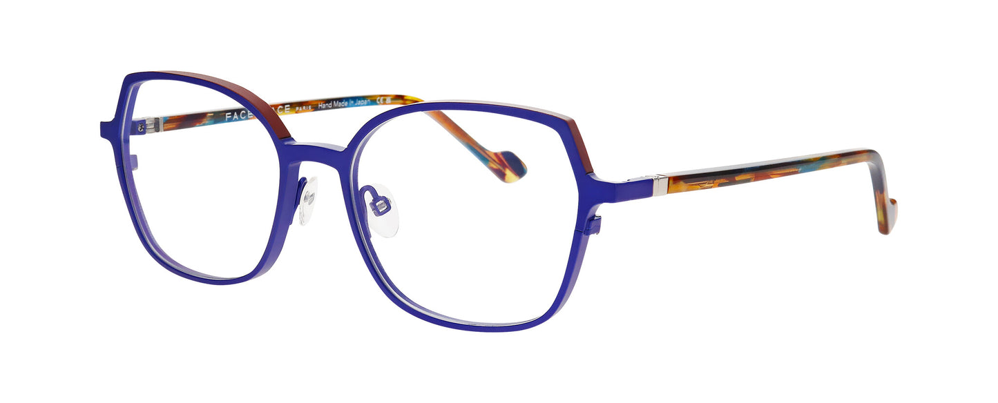 Women's prescription eyewear – A partial side view of a titanium frame that is in a cat-eye shape and matt purple colour. The temples are made with acetate and in a mix of translucent blue/red/gold colours.