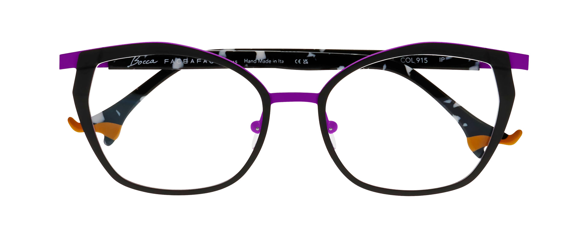 Women's prescription eyewear – A front view of an oval titanium frame that is black and purple in colour.  The black and white speckled temples are finished with orange ladies’ shoe tips
